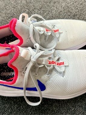 Nike Women’s White Athletic Sneakers with Pink Collar and Blue Swoosh